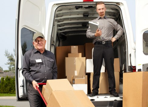 Local removal team loading furniture for a Barnet home move
