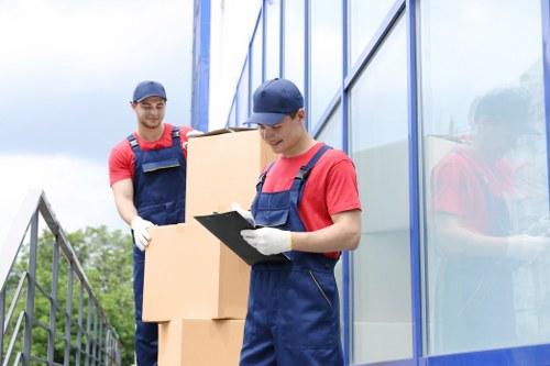 Movers assessing a property for risks before a Barnet relocation