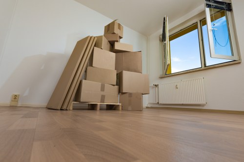 Specialist team handling an upright piano move in Barnet