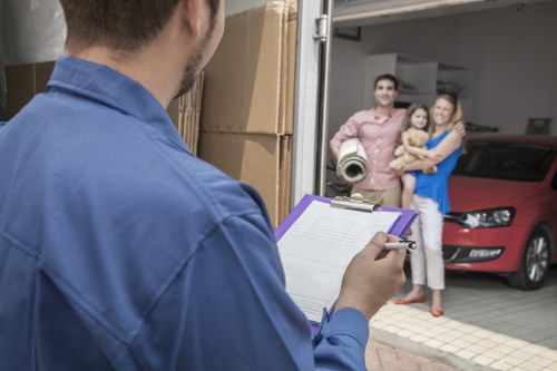 Removal quote paperwork beside stacked moving boxes