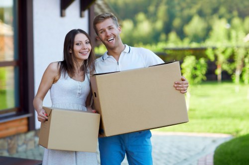 Professional movers packing household items for a Barnet relocation