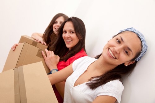 Local movers in Barnet handling furniture and fragile items with protective wrapping