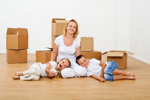Packed office boxes and furniture ready for removal in Barnet
