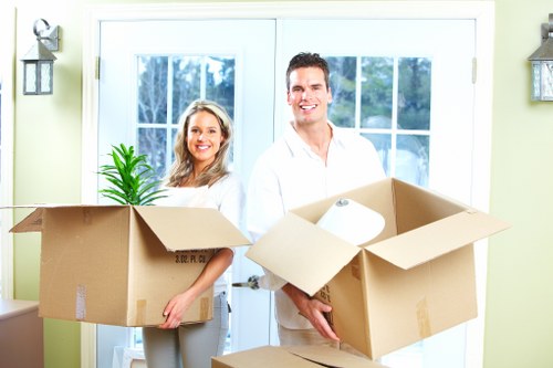 Professional movers loading belongings for flat removals in Barnet