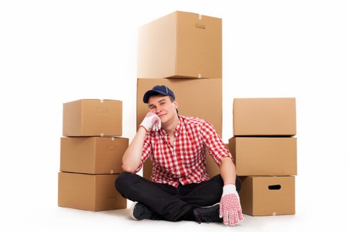 Barnet moving team protecting sofas and cabinets during furniture removals